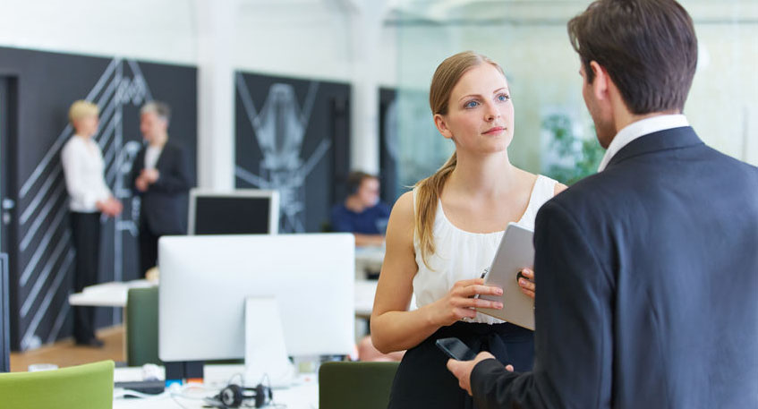 39539633 - man and woman in office talking to each other in a break